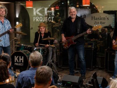 Hasim's, Members, Musiker, KH Project, Rock & Blues, Küre Hauser, Schlagzeuger, Schlagzeug, Rock und Blues, heimische Musikszene, Band, Bern, Bühne, handgemachte Musik, Berner Rockmusik, Lindbergh, Ocean, No Problem, Roots 66 feat. Polo Hofer, Konzert, Jack Minnig, Gitarre, HUBER MINNIG, BMG Ariola, Country, R&R Oldies, Kuno Lauener, Büne Huber, Endo Anaconda, Schmidi Schmidhauser, René Eberhard, Bass, Grooves, E-Bass, Rolf LL Lüthi, Matthias Heimlicher, Vlada, Philipp Fankhauser, Rockustics, Tutti Matti, Magna Carta, Andy Maurer, Hanery Amman. Professor Miquel Rubio, Konservatorium Bern, AM Gitarren & Bass Schule, Tres Pesetas, Acoustic Latin Gitarren Trio, Van Dox, Rock Cover Band Copperhead, Folk Rock Miraval Bamboo Faya, Reggea um Peppe Claudio (the Wailers) Bonnie & the Groove Cats, Plüsch, Andreas Vollenweider, Mich Gerber, Bellamy Brothers, Kenny Moore (Tina Turner), Sandee, Andy Pupato, Junior Marvin, Bob Marley, Referenze, Kontakt, Galerie, Audio & Video, Events, Video/Audio, Logos & Bandfotos, Stageplan